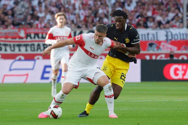 Pictured, from left: Ermedin Demirovic (VfB Stuttgart), No. 9, in a tackle against Joane Gadou (Borussia Dortmund), No. 22, September 19, 2026, VfB Stuttgart vs. Borussia Dortmund, Bundesliga Matchday 4, Germany, Stuttgart, MHP Arena. DFL regulations prohibit any use of photographs as image sequences and or quasi-video. Copyright: HMBxMedia xJulienxBecker