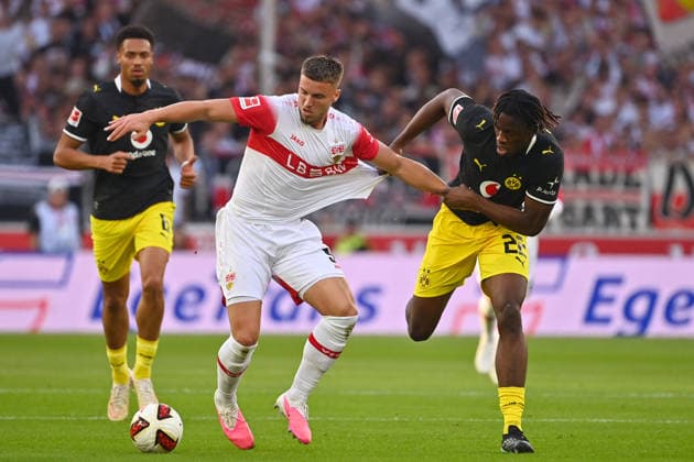 Joane GADOU, Borussia Dortmund, in action, tackling Ermedin DEMIROVIC, VFB Stuttgart, Soccer, 1. Bundesliga, 2026–2027 season, Matchday 4, Matchday 04, VfB Stuttgart vs. Borussia Dortmund on September 19, 2026, MHP ARENA
