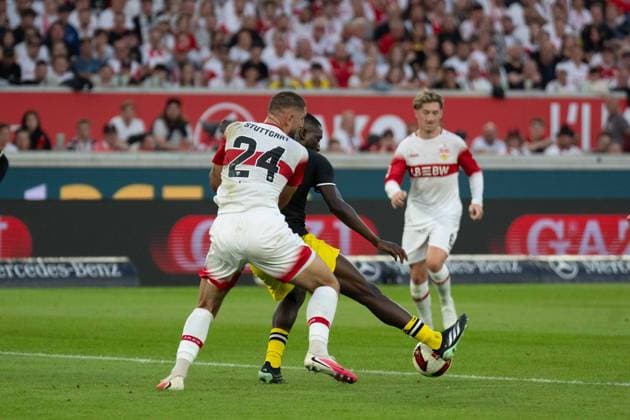 September 19, 2026: Soccer, VfB Stuttgart vs. Borussia Dortmund, Matchday 4 of the 1. Bundesliga at the MHP Arena; Serhou Guirassy (Borussia Dortmund) vs. Finn Jeltsch (VfB Stuttgart), 29 IMPORTANT NOTICE: In accordance with DFL and DFB regulations, it is prohibited to use or allow the use of photographs taken inside the stadium and or during the game in the form of sequential images and or video-like photo series. Copyright: xJamesxZabelx