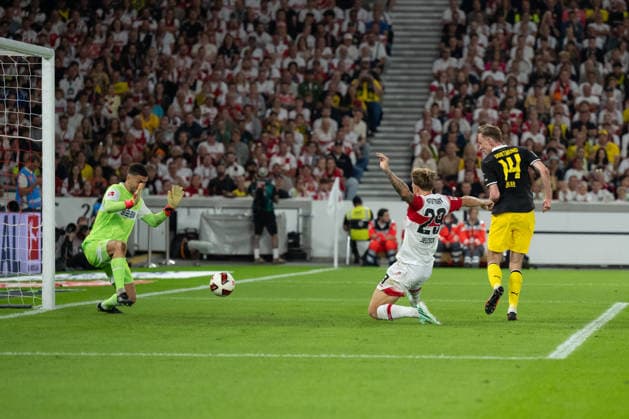 September 19, 2026, Germany, Soccer, Men s, 1. Bundesliga, 2026–2027 season, Matchday 4, VfB Stuttgart vs. Borussia Dortmund; goal making it 0–1 by Maximilian Beier (Borussia Dortmund), 14, left: Fabian Bredlow (VfB Stuttgart), 01, Finn Jeltsch (VfB Stuttgart), 29. DFB and DFL regulations prohibit any use of photographs as image sequences and or quasi-video. Stuttgart MHP Arena, Baden-Württemberg, Germany Copyright: xNordphoto WolfgangxFrankx