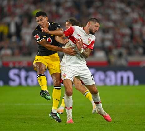 September 19, 2026, Soccer, Bundesliga 1, 2026–2027, Matchday 4, VfB Stuttgart vs. Borussia Dortmund, at the MHP Arena in Stuttgart, from left: Jobe Bellingham (Borussia Dortmund) vs. Jeff Chabot (Stuttgart)