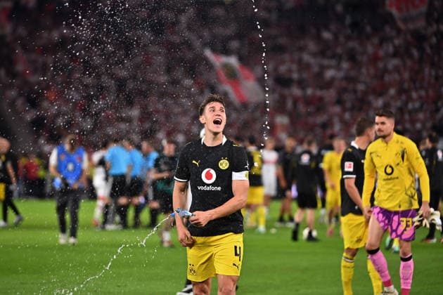 Maximilian BEIER of Borussia Dortmund celebrates at the final whistle, spraying water from a bottle; celebration, joy, excitement, action, single frame, cropped close-up, half-length shot, soccer, 1. Bundesliga, 2026–2027 season, Matchday 4, Matchday 04, VfB Stuttgart vs. Borussia Dortmund 0–1 on September 19, 2026, MHP ARENA
