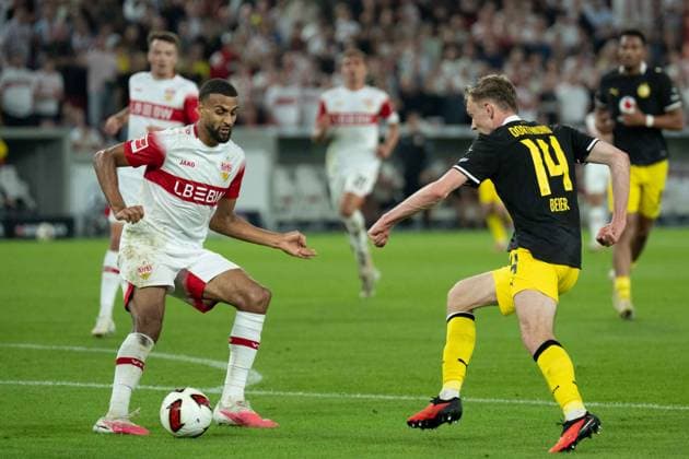 September 19, 2026: Soccer – VfB Stuttgart vs. Borussia Dortmund, Matchday 4 of the Bundesliga at the MHP Arena; Maximilian Beier (Borussia Dortmund), 14; Tunnel; Josha Vagnoman (VfB Stuttgart), 4 IMPORTANT NOTICE: In accordance with the guidelines of the DFL and the DFB, it is prohibited to use or allow the use of photographs taken in the stadium and or during the game in the form of sequential images and or video-like photo series. Copyright: xJamesxZabelx