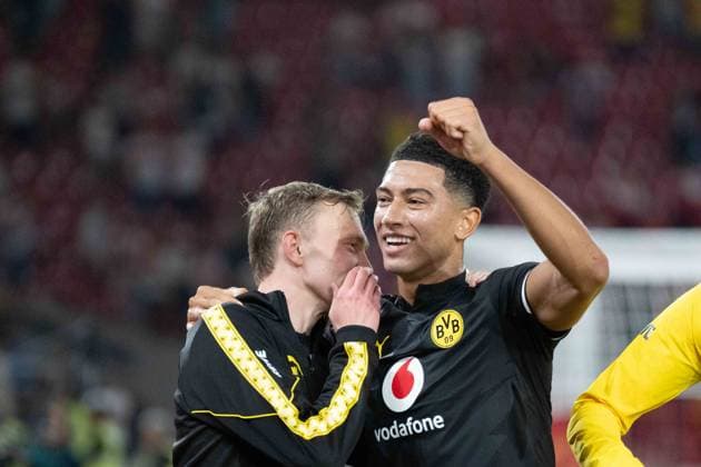 September 19, 2026: Soccer—VfB Stuttgart vs. Borussia Dortmund, Matchday 4 of the Bundesliga 1 at the MHP Arena: Maximilian Beier (Borussia Dortmund, 14) and Jobe Bellingham (Borussia Dortmund, 7) celebrating after the final whistle in front of the Dortmund Kurve IMPORTANT NOTICE: In accordance with DFL and DFB regulations, it is prohibited to use or allow the use of photographs taken in the stadium and or during the game in the form of sequential images and or video-like photo sequences. Copyright: xJamesxZabelx