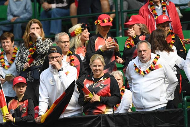 German tennis fans, dressed in black, red, and gold; feature; border image; symbolic photo; match 1: Alexander ZVEREV (GER) vs. Matej DODIC (CRO); Germany (GER) vs. Croatia (CRO); Tennis Davis Cup Qualifiers, Round 2, on September 19, 2026, at the Heristo Arena in Halle, Westphalia, Germany Â