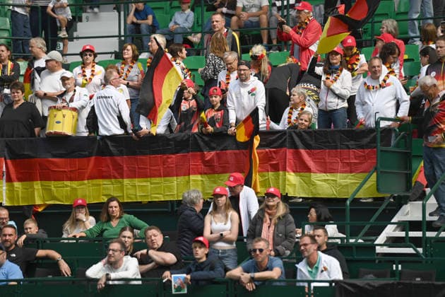 German tennis fans, dressed in black, red, and gold; feature; border image; symbolic photo; match 1: Alexander ZVEREV (GER) vs. Matej DODIC (CRO); Germany (GER) vs. Croatia (CRO); Tennis Davis Cup Qualifiers, Round 2, on September 19, 2026, at the Heristo Arena in Halle, Westphalia, Germany Â