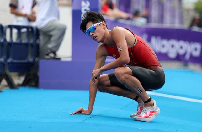 (260920) -- NAGOYA, Sept. 20, 2026 -- Zhang Xirui of China reacts after the men s individual triathlon final at the 20th Asian Games Aichi-Nagoya 2026 in Gamagori City of Aichi prefecture, Japan, Sept. 20, 2026. ) (SP)JAPAN-NAGOYA-ASIAN GAMES-TRIATHLON-MEN S INDIVIDUAL DengxHua 
