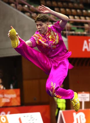(260920) -- NAGOYA, Sept. 20, 2026 -- Kuong Chi Hin of China s Macao competes during the Men s Changquan Final of Wushu at the 20th Asian Games Aichi-Nagoya 2026 in Nagoya of Aichi Prefecture, Japan, Sept. 20, 2026. ) (SP)JAPAN-NAGOYA-ASIAN GAMES-CYCLING ROAD-MEN S CHANGQUAN WangxDongzhen 