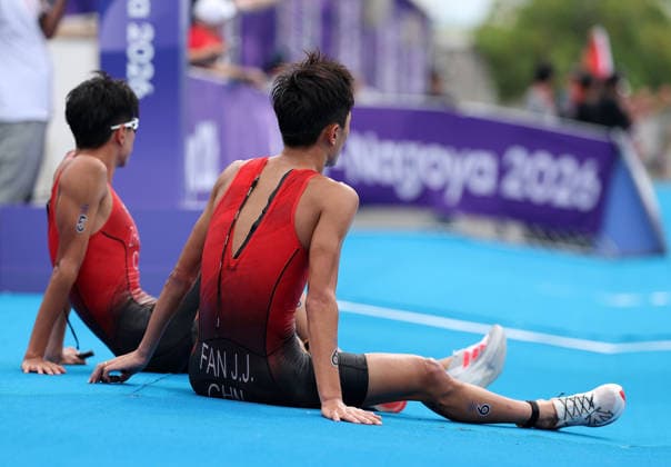 (260920) -- NAGOYA, Sept. 20, 2026 -- Zhang Xirui and Fan Junjie (R) of China react after the men s individual final of triathlon at the 20th Asian Games Aichi-Nagoya 2026 in Gamagori City of Aichi Prefecture, Japan, Sept. 20, 2026. ) (SP)JAPAN-NAGOYA-ASIAN GAMES-TRIATHLON-MEN S INDIVIDUAL DengxHua 