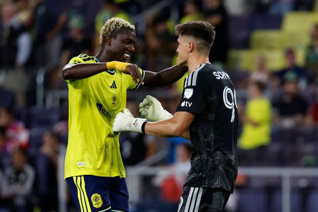 NASHVILLE, TN - SEPTEMBER 19: Nashville SC defender Maxwell Woledzi (3) goes in for a hug with Nashville SC goalkeeper Brian Schwake (99) following a goal during a match between Nashville SC and Chicago Fire FC, September 19, 2026 at GEODIS Park in Nashville, Tennessee. (Photo by Matthew Maxey Icon Sportswire) SOCCER: SEP 19 MLS, Fussball Herren, USA Nashville SC vs Chicago Fire FC EDITORIAL USE ONLY Icon260919027