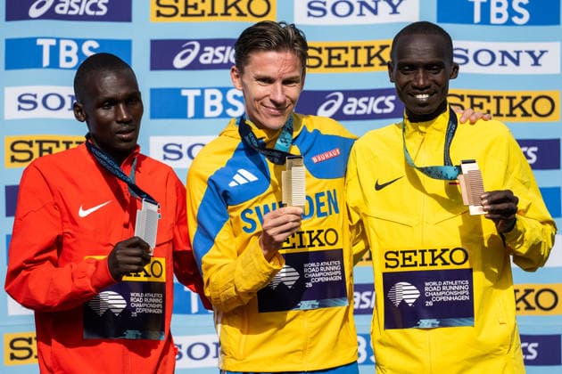 September 26, 2020: Nicholas Kipkorir of Kenya, Andreas Almgren of Sweden, and Joshua Cheptegei of Uganda celebrate on the podium after the Copenhagen Half Marathon at the World Athletics Road Running Championships on September 20, 2026 in Copenhagen. Photo by Mathilda Schuler, BILDBYRAN, code MA MA1036. athletics, world athletics road running championships, Copenhagen Half Marathon 2026, BBENG Half Marathon, celebration Copyright: MATHILDAxSCHULER BB260920MA074