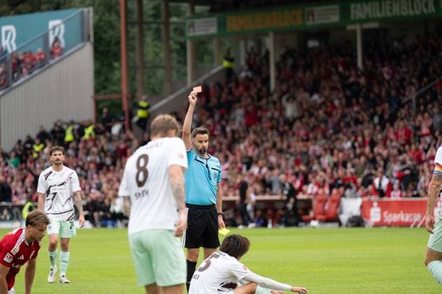September 20, 2026: Energie Cottbus vs. FC St. Pauli, Matchday 6 of the 2. Bundesliga at the LEAG Energie Stadium; Yellow-red card for Tomoya Ando (FC St. Pauli), 15 IMPORTANT NOTICE: In accordance with DFL and DFB regulations, it is prohibited to use or allow the use of photographs taken in the stadium and or during the game in the form of sequential images and or video-like photo series. Copyright: xJamesxZabelx