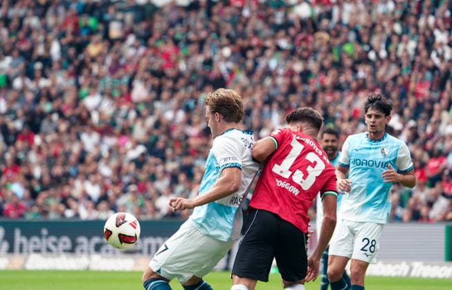 Germany Soccer 2. Bundesliga 2026–2027, Matchday 6: Hannover 96 vs. VfL Bochum at Heinz von Heiden Arena Stadium in Hannover—Christian Rasmussen (VfL Bochum) and Franz Roggow (Hannover 96) in a tackle, 13 Copyright: xAymanxAlahmedx