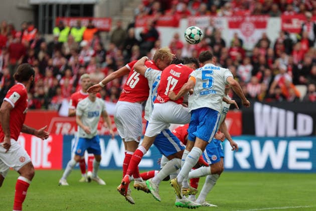 Essen, Germany, September 20, 2026; 3. Liga 2026–2027, Matchday 7: Rot-Weiss Essen vs. FC Hansa Rostock. Pictured, from left, in a tackle: Nick Bätzner (Baetzner) of RWE, Semir Telalovic (RWE), and Marco Schuster (FCH). DFB and DFL regulations prohibit any use of photographs as image sequences and or quasi-video. Stadion an der Hafenstraße, North Rhine-Westphalia Copyright: xFotostandx xFWMEDIAx