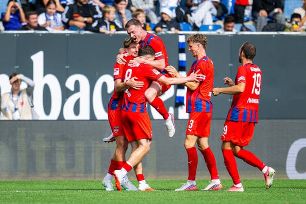 September 20, 2026 Soccer, 2026–2027, 2. Bundesliga, Matchday 6, DSC Arminia Bielefeld 1 FC Heidenheim. M Paul Hennrich of Heidenheim celebrates after scoring the goal to make it 1–2, surrounded by L–R Alessandro Vogt (Heidenheim), Budu Zivzivadze (Heidenheim), Jan Schöppner (Heidenheim), and Jonas Föhrenbach (Heidenheim). DFL regulations prohibit any use of photographs as image sequences and or quasi-video.