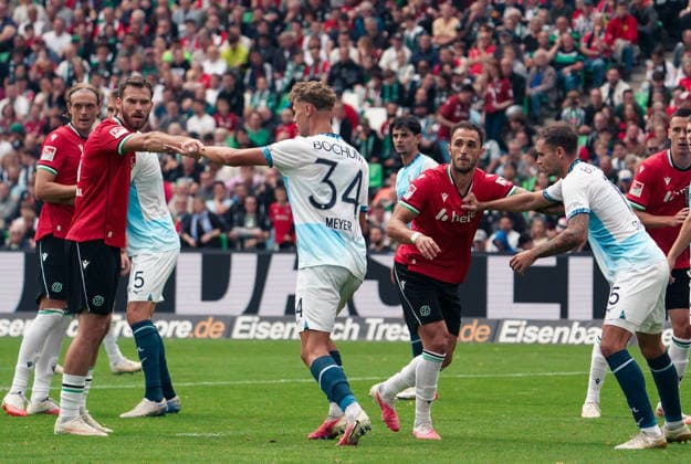 Germany Soccer 2. Bundesliga 2026–2027, Matchday 6: Hannover 96 vs. VfL Bochum at Heinz von Heiden Arena Stadium in Hannover; corner kick by Virgil Ghi?a (Virgil Ghita) of Hannover 96, 5; Boris Tomiak of Hannover 96, 3; Tom Meyer of VfL Bochum, 34; Karol Mets of VfL Bochum, 5 Copyright: xAymanxAlahmedx