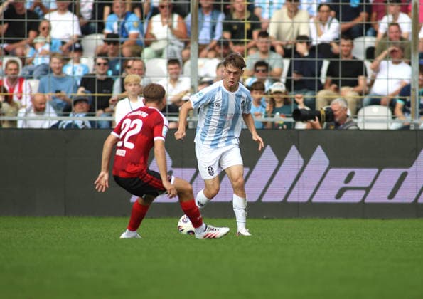 Soccer, Men s, Bavarian Regional League, 2026–2027 Season, TSV 1860 Munich vs. 1. FC Nürnberg II, Grünwalder Stadium. Noel Kaiser (1. FC Nürnberg II, left) and Emre Erdogan (TSV 1860 Munich, right) battle for the ball during an attack.