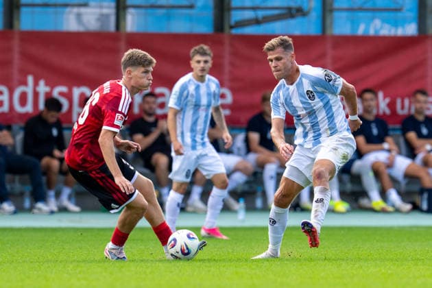 Men s Soccer, Bavarian Regional League, 2026–2027 Season, Matchday 10, September 20, 2026: TSV 1860 Munich vs. 1. FC Nürnberg II. Kristian Mandic of 1. FC Nürnberg II (L) in a tackle with Florian Niederlechner of TSV 1860 Munich, Munich Stadium on Grünwalder Straße, Bavaria, Germany