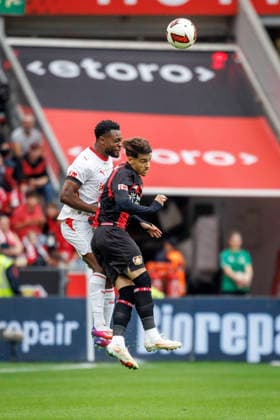 LEVERKUSEN, GERMANY - SEPTEMBER 20, 2026: Ridle Baku (RB Leipzig, 17) and Afonso Moreira (Bayer 04 Leverkusen, 9) in a header duel during the German Bundesliga match on gameday 4 between Bayer 04 Leverkusen vs. RB Leipzig at BayArena on September 20, 2026 in Leverkusen, Germany. DFL REGULATIONS PROHIBIT ANY USE OF PHOTOGRAPHS AS IMAGE SEQUENCES AND OR QUASI-VIDEO. Northrhine-Westphalia Germany Copyright: xAxelxKohringx