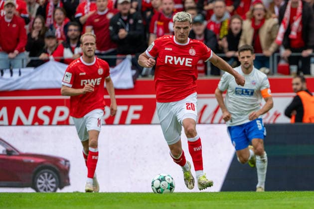 Lucas Brumme, Rot Weiss Essen, 14, Marek Janssen, Rot Weiss Essen, 20, runs with the ball, Marco Schuster, FC Hansa Rostock, 05, Rot-Weiss Essen vs. FC Hansa Rostock, soccer, 3rd Division, Matchday 7, 2026–27 season, September 20, 2026, DFL regulations prohibit any use of photographs as image sequences and or quasi-video; Rot-Weiss Essen vs. FC Hansa Rostock, Soccer, 3rd Division, Matchday 7, 2026–27 Season, September 20, 2026, Essen Copyright: xEibner-Pressefoto LukasxBaldygax EP_LBA