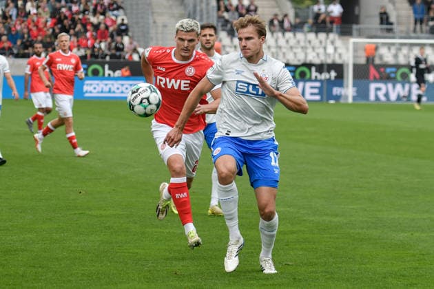 From left in a one-on-one situation: Marek Janssen (Essen), 20; Florian Carstens (Rostock), 17; 2009; 2026 ¢ Soccer ¢ Rot-Weiss Essen vs. Hansa Rostock, Essen Stadium, Essen, DFB DFL regulations prohibit any use of photographs as image sequences and or quasi-video. NRW, Germany Copyright: xpepphotox xSaschaxWeizx pep00321, pep_20260920_hm