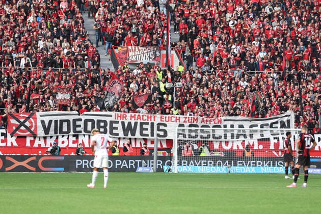Bayer 04 Leverkusen fans are seen with flags, banners, and the message Abolish video review during the Bundesliga match between Bayer 04 Leverkusen and RB Leipzig at the BayArena on September 20, 2026, in Leverkusen, Germany Photo by Oliver Kaelke, DeFodi Images Supporters of Bayer 04 Leverkusen are seen with flags, banners, and the message Abolish video evidence during the Bundesliga match between Bayer 04 Leverkusen and RB Leipzig at BayArena on September 20, 2026 in Leverkusen, Germany. Photo by Oliver Kaelke, DeFodi Images. DFB and DFL regulations prohibit any use of photographs as image sequences and or quasi-video. Photo by Oliver Kaelke, DeFodi Images.