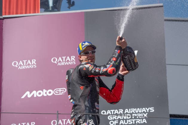 MOTORSPORTS - MotoGP - Austrian Grand Prix Photo by IPA ABACAPRESS.COM88760154 - Marco Bezzecchi (Aprilia Racing) celebrating his victory on the podium after the Grand Prix race of the Austrian MotoGP Grand Prix at the Red Bull Ring racetrack in Spielberg, Austria, on September 20, 2026. Austria Austria  Copyright: xIPAxSport ABACAx