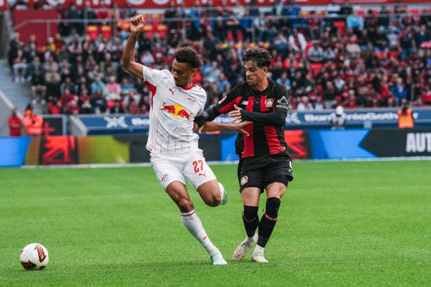 September 20, 2026, xjmrgnx, Soccer, Bundesliga 1, Bayer 04 Leverkusen vs. RB Leipzig: A tackle between Tidiam Gomis 27, Leipzig and Miguel Gutierrez 3, Leverkusen. DFL and DFB regulations prohibit any use of photographs as image sequences and or quasi-video. Leverkusen