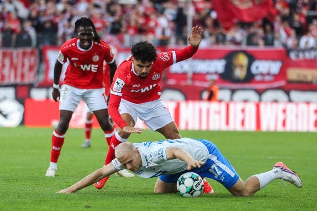 Soccer, 3rd Division, Matchday 7: Rot Weiss Essen vs. Hansa Rostock on September 20, 2026, at the Stadion an der Hafenstraße in Essen. Milosz Brzozowski (Rostock) in the foreground; Aiman Dardari (Essen) in the background. DFB regulations prohibit any use of photographs as image sequences and or quasi-video. xJRx