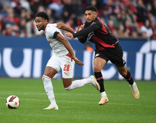 September 20, 2026, xophax, Soccer, Bundesliga 1, Bayer 04 Leverkusen vs. RB Leipzig: Christopher Nkunku (RB Leipzig), left, and Jarell Quansah (Bayer 04). DFL and DFB regulations prohibit any use of photographs as image sequences and or quasi-video. Leverkusen