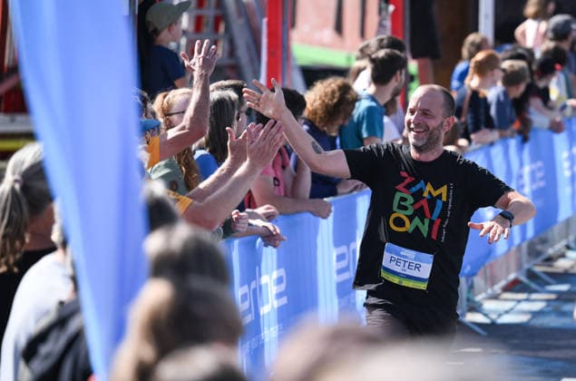 Running, Track and Field, Tübingen City Run, 33rd Erbelauf 2026, September 20, 2026, Featured Image: Peter Kreutmayr, Circus Zambaioni high-fives the audience on Europaplatz