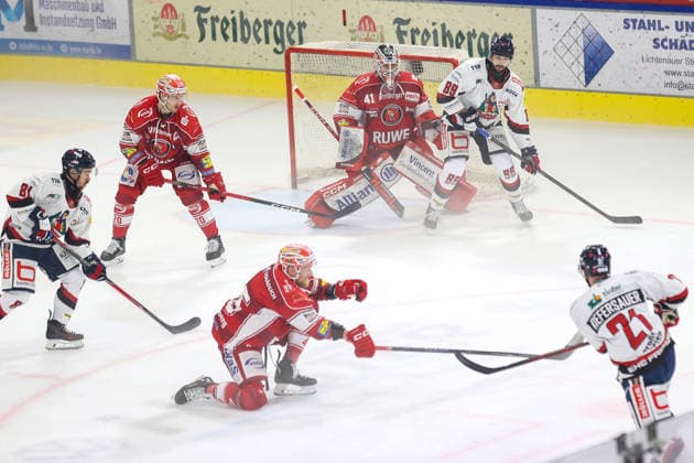 Sahnpark Crimmitschau, September 20, 2026; 2026–27 Season; Ice Hockey; 2nd Bundesliga; Regular Season; Game 2; Saxony Artificial Ice Arena; Eispiraten; Eispiraten; EHC Freiburg; Christoph Kiefersauer; Freiburg 21 pulls away; Stanislav Dietz; EPC red holds the stick out behind him; Kevin Reich (EPC) goalie and Sebastian Streu (Freiburg 89) wait for the puck; Crimmitschau, Saxony, Germany