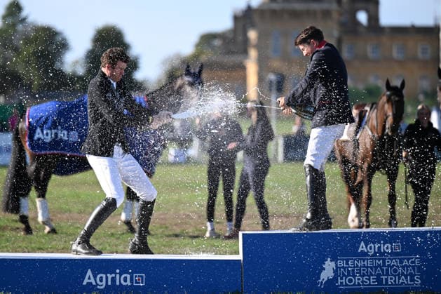 RECORD DATE NOT STATED 20th September 2026; Blenheim Palace, Woodstock, Oxfordshire, England; Blenheim Palace International Horse Trials Final Day; Tom McEwen and Sam Ecroyd spray Champagne on the Podium after The Fieldmaster ridden by Tom McEwen of Great Britain wins the Blenheim Palace 4* Long Competition with Brookfield Quality also ridden by Tom McEwen of Great Britain in second place and Jackpot ridden by Sam Ecroyd of Great Britain in third place SimonxWest