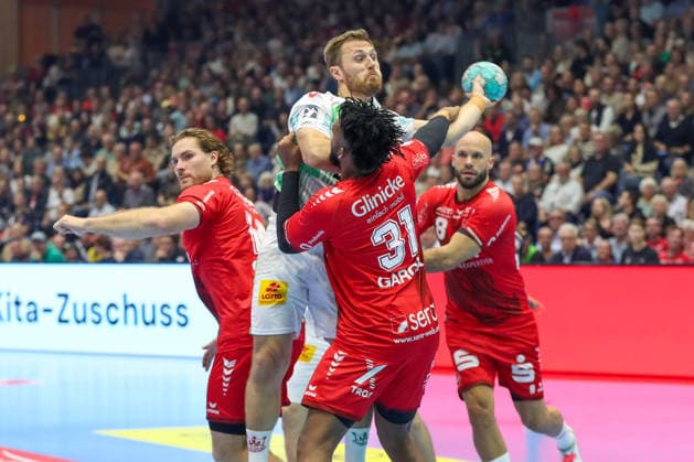 September 20, 2026, xgox, Handball Opel HBL MT Melsungen vs. SC Magdeburg emspor, from left: Dariel Garcia Rivera (Melsungen), 31, Albin Lagergren (Magdeburg), 21; duel, battle, tackle, Kassel