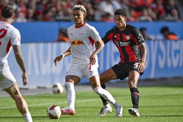 LEVERKUSEN - (lr) Antonio Nusa of RB Leipzig, Jarell Quansah of Bayer 04 Leverkusen during the match between Bayer 04 Leverkusen and RB Leipzig at the Bay Arena on 20 September 2026 in Leverkusen, Germany. ANP Bundesliga 2026 27 xVIxANPxSportx xGerritxvanxKeulenxIVx 569419633 originalFilename: 569419633.jpg