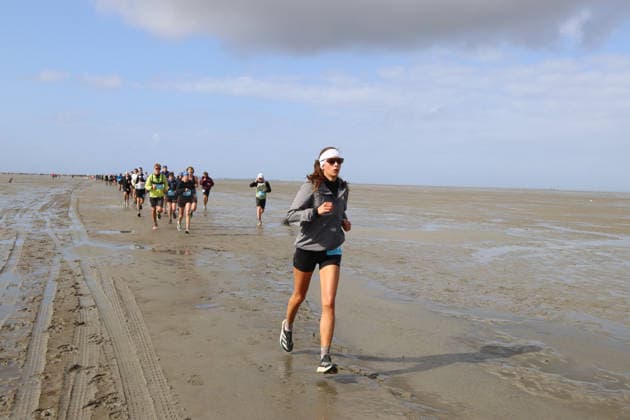 Participants in the 2nd Red Bull Watt Run from the beach in Duhnen to Neuwerk and back. Because a strong westerly wind had pushed a lot of water into the southwestern part of the German Bight in the days leading up to the event, the route had to be adjusted.