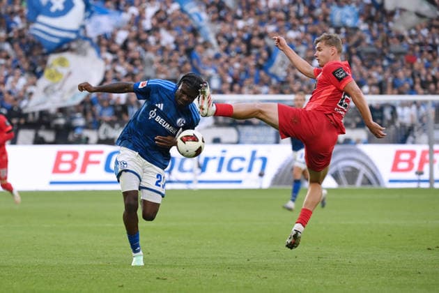 Junior Dina Ebimbe, FC Schalke 04; Lasse Günther, SV Elversberg; from left, September 20, 2026; Soccer, 1. Bundesliga, 2026–2027 season; Matchday 4, FC Schalke 04 vs. SV Elversberg. DFL regulations prohibit any use of photographs as image sequences and or quasi-video. Gelsenkirchen, Veltins Arena, North Rhine-Westphalia, Germany Team2
