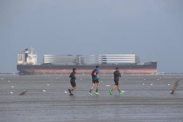 Participants in the 2nd Red Bull Watt Run from the beach in Duhnen to Neuwerk and back. Because a strong westerly wind had pushed a lot of water into the southwestern part of the German Bight in the days leading up to the event, the route had to be adjusted