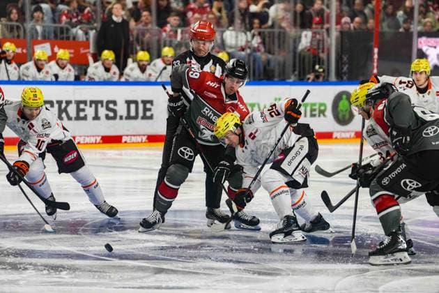 Ice Hockey: Penny DEL, Matchday 2—Cologne Sharks vs. Frankfurt Lions on September 20, 2026, at the Lanxess Arena in Cologne. Brandon Biro (Frankfurt), left: Gregor MacLeod (Cologne), center: Anthony Romano (Frankfurt), right: In accordance with the regulations of the DEL (German Ice Hockey League), the publication and reuse of these images in electronic media and on devices of any kind during the game is not permitted. xDMx