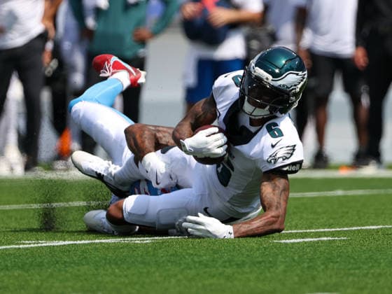 Sep 20, 2026; Nashville, TN, USA; Philadelphia Eagles wide receiver DeVonta Smith (6) is tackled by Tennessee Titans cornerback Alontae Taylor (24) after making a reception during the NFL, American Football Herren, USA regular season game between the Philadelphia Eagles and Tennessee Titans at Nissan Stadium. Mandatory Credit: -Cal Media NFL 2026: Eagles Vs Titans SEP 20  - ZUMAc04_ 20260920_zma_c04_020 Copyright: xStephenxFurstx