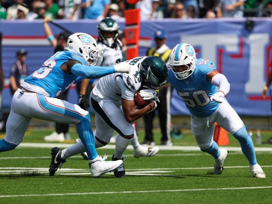 Sep 20, 2026; Nashville, TN, USA; Philadelphia Eagles wide receiver Dontayvion Wicks (13) is tackled by Tennessee Titans linebacker Cody Barton (50) and linebacker Anthony Hill Jr. (53) during the NFL, American Football Herren, USA regular season game between the Philadelphia Eagles and Tennessee Titans at Nissan Stadium. Mandatory Credit: -Cal Media NFL 2026: Eagles Vs Titans SEP 20  - ZUMAc04_ 20260920_zma_c04_023 Copyright: xStephenxFurstx