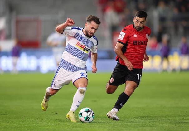 September 20, 2026, 3rd Division Soccer, SV Wehen Wiesbaden vs. MSV Duisburg, from left: Can Coskun (MSV Duisburg), Tarik Gözüsirin (SV Wehen Wiesbaden). DFL and DFB regulations prohibit any use of photographs as image sequences and or quasi-video. xdcx Copyright: HMBxMedia Claus