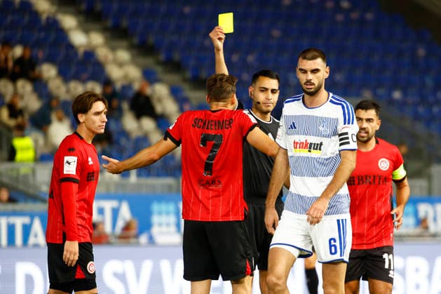September 20, 2026, xavx, Soccer 3rd Division, SV Wehen Wiesbaden vs. MSV Duisburg: Referee Cengiz Kabalakli shows a yellow card to Lukas Schleimer of SV Wehen Wiesbaden, Wiesbaden