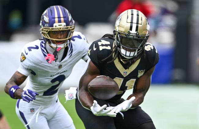 New Orleans Saints running back Alvin Kamara (41) makes a reception in front of Baltimore Ravens cornerback Nate Wiggins (2) on a short gain during the second quarter of the Ravens home opener game at M&T Bank Stadium in Baltimore, Maryland, on Sunday, September 20, 2026.  BAL20260920111 DAVIDxTULIS