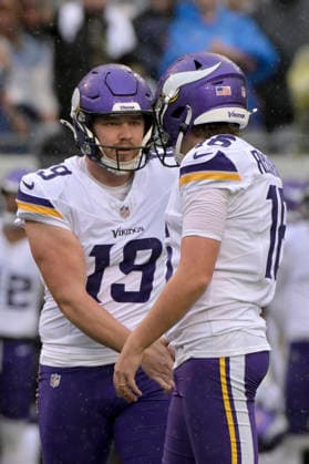 Minnesota Vikings punter Brett Thorson (19) congratulates Minnesota Vikings place kicker Will Reichard (16) on his first quarter field goal against the Chicago Bears during a game at Soldier Field in Chicago on Sunday, September 20, 2026.  CHI20260920102 MARKxBLACK