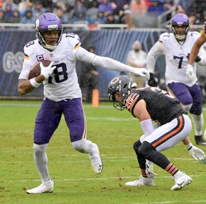 Minnesota Vikings wide receiver Justin Jefferson (18) avoids the tackle by Chicago Bears safety Dillon Thieneman (31) during a game at Soldier Field in Chicago on Sunday, September 20, 2026.  CHI20260920109 MARKxBLACK