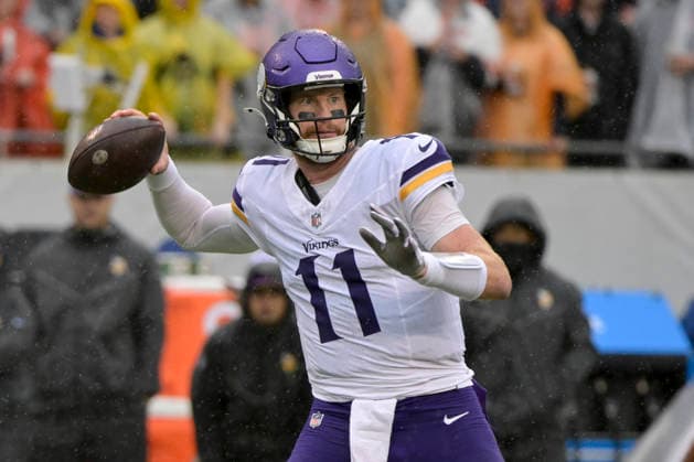 Minnesota Vikings quarterback Carson Wentz (11) pass the ball in the first quarter against the Chicago Bears at Soldier Field in Chicago on Sunday, September 20, 2026.  CHI20260920101 MARKxBLACK