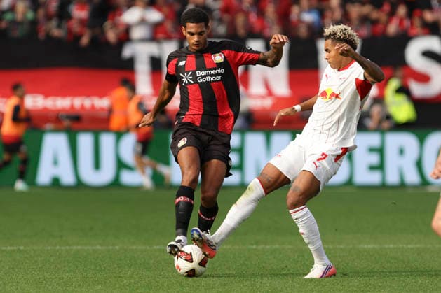 Jarell Quansah of Bayer 04 Leverkusen and Antonio Nusa of RB Leipzig battle for the ball during the Bundesliga match between Bayer 04 Leverkusen and RB Leipzig at BayArena on September 20, 2026, in Leverkusen, Germany Photo by Oliver Kaelke, DeFodi Images Jarell Quansah of Bayer 04 Leverkusen and Antonio Nusa of RB Leipzig battle for the ball during the Bundesliga match between Bayer 04 Leverkusen and RB Leipzig at BayArena on September 20, 2026 in Leverkusen, Germany. Photo by Oliver Kaelke, DeFodi Images. DFB and DFL regulations prohibit any use of photographs as image sequences and or quasi-video. Photo by Oliver Kaelke, DeFodi Images.