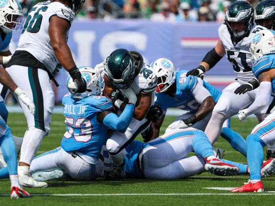 Sep 20, 2026; Nashville, TN, USA; Philadelphia Eagles running back Saquon Barkley (26) is stopped by Tennessee Titans linebacker Anthony Hill Jr. (53) during the NFL, American Football Herren, USA regular season game between the Philadelphia Eagles and Tennessee Titans at Nissan Stadium. Mandatory Credit: -Cal Media Nashville USA - ZUMAc04_ 20260920_zma_c04_071 Copyright: xStephenxFurstx