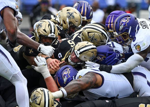 New Orleans Saints quarterback Tyler Shough (6) attempts a one-yard-run against the Baltimore Ravens but is stopped on the goal line during the fourth quarter at M&T Bank Stadium in Baltimore, Maryland, on Sunday, September 20, 2026. Shough scored on the next play.  BAL20260920134 DAVIDxTULIS